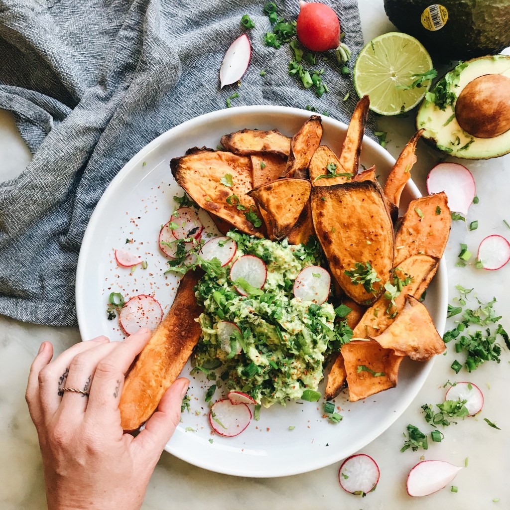 Baked Sweet Potato Chips with Roasted Garlic Guacamole a recipe from